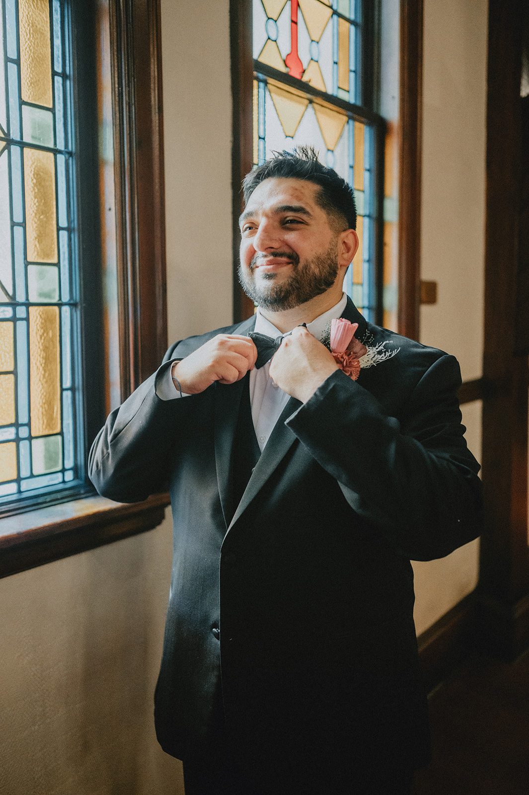 Groom adjusting his cufflinks Groom adjusting his cufflinks