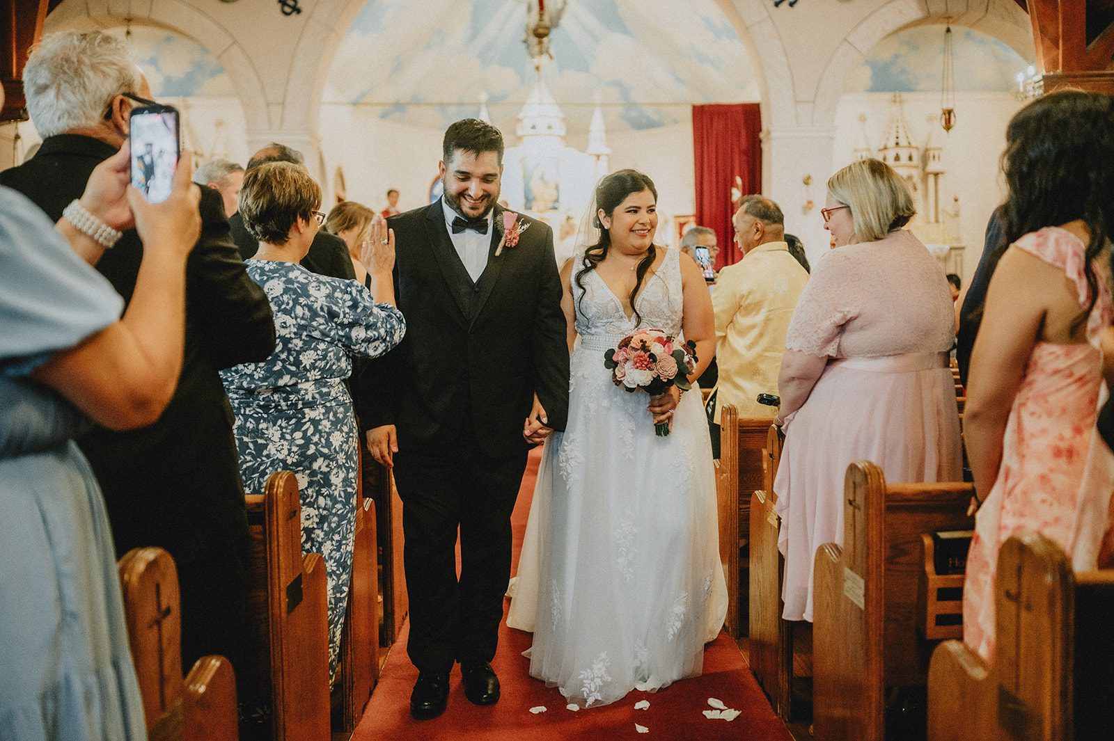 Newlyweds walking out of the church Newlyweds walking out of the church