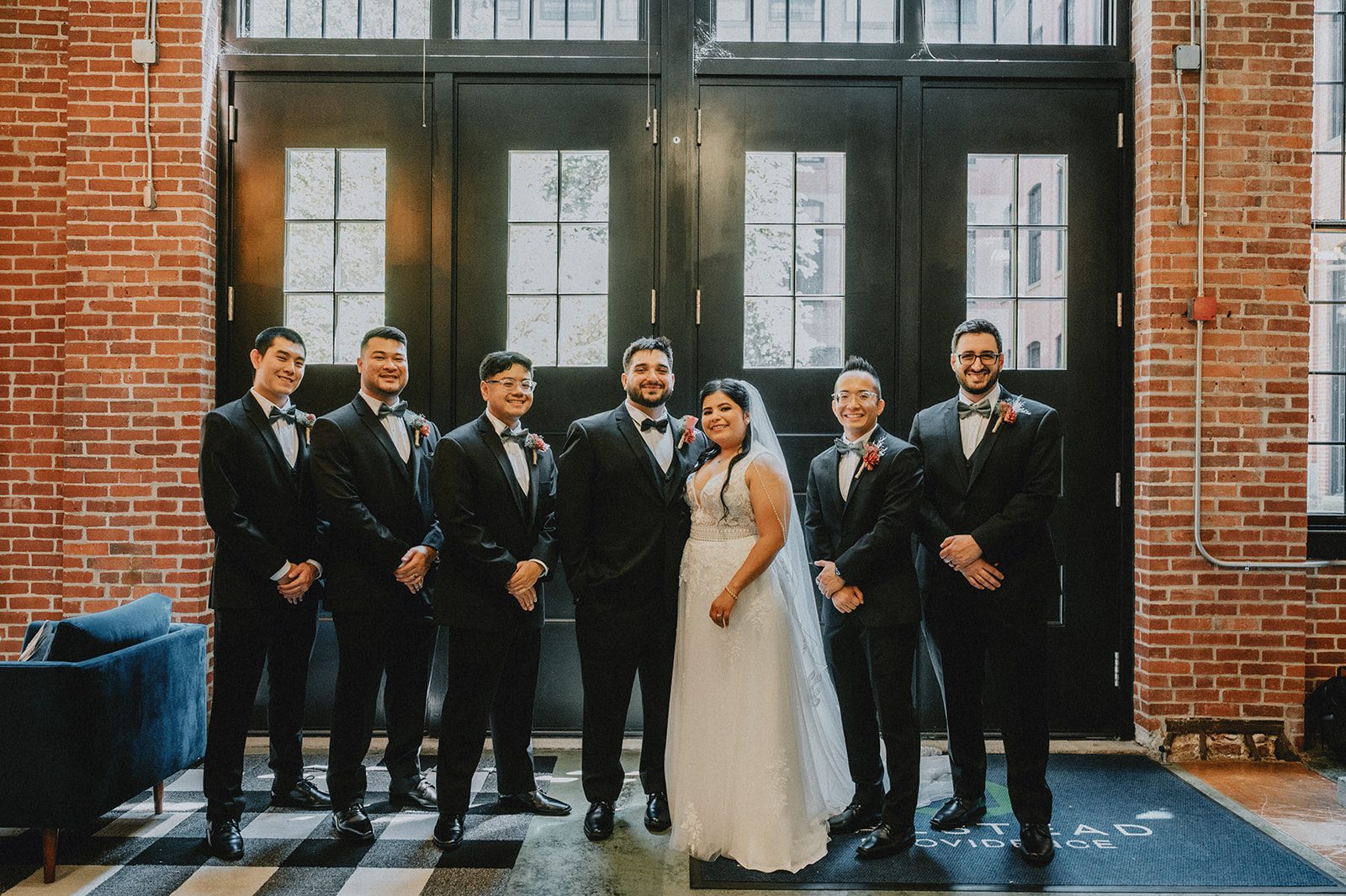 Wedding party at the barn doors at The Barn at Blackstone National Wedding party at the barn doors at The Barn at Blackstone National