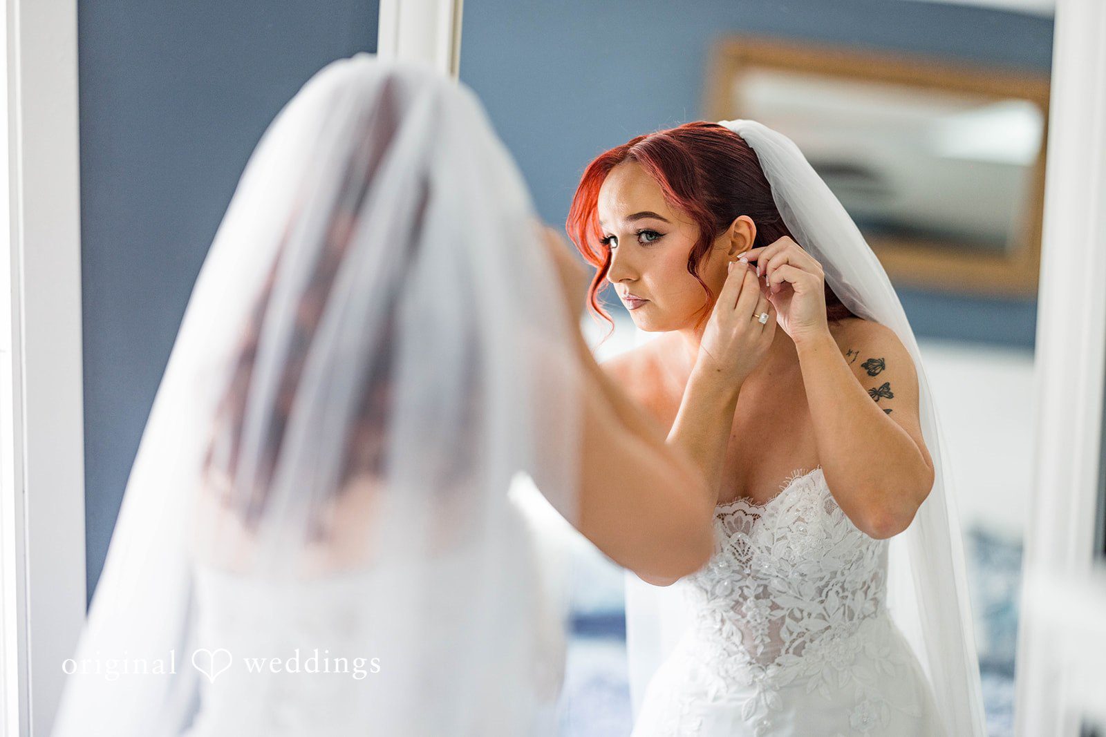 Andrea + Roberto Bride adjusting her veil while getting ready