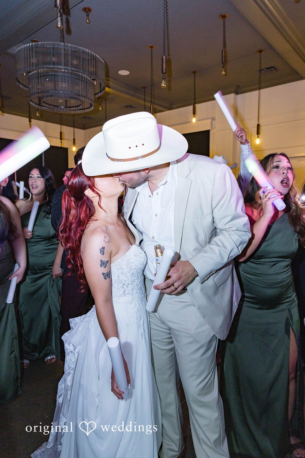 Andrea + Roberto Couple sharing a kiss on the dance floor