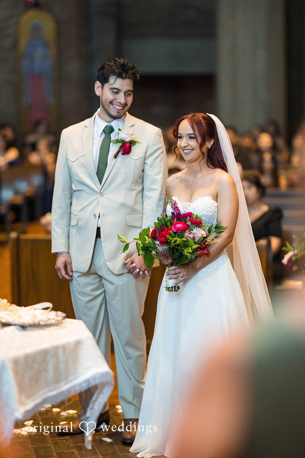 Andrea + Roberto Bride and groom smiling inside the church