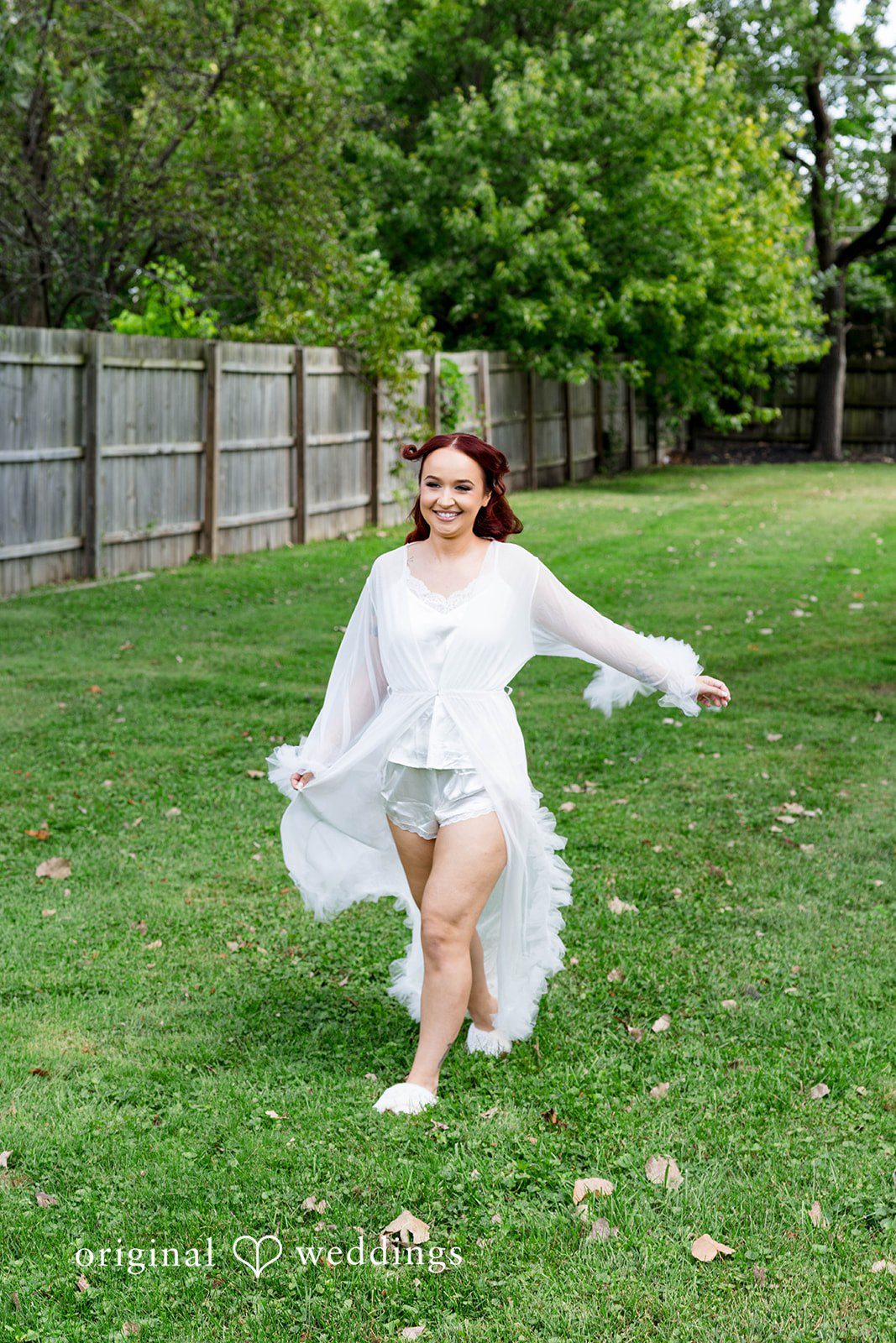 Andrea + Roberto Bride twirling her gown on the lawn