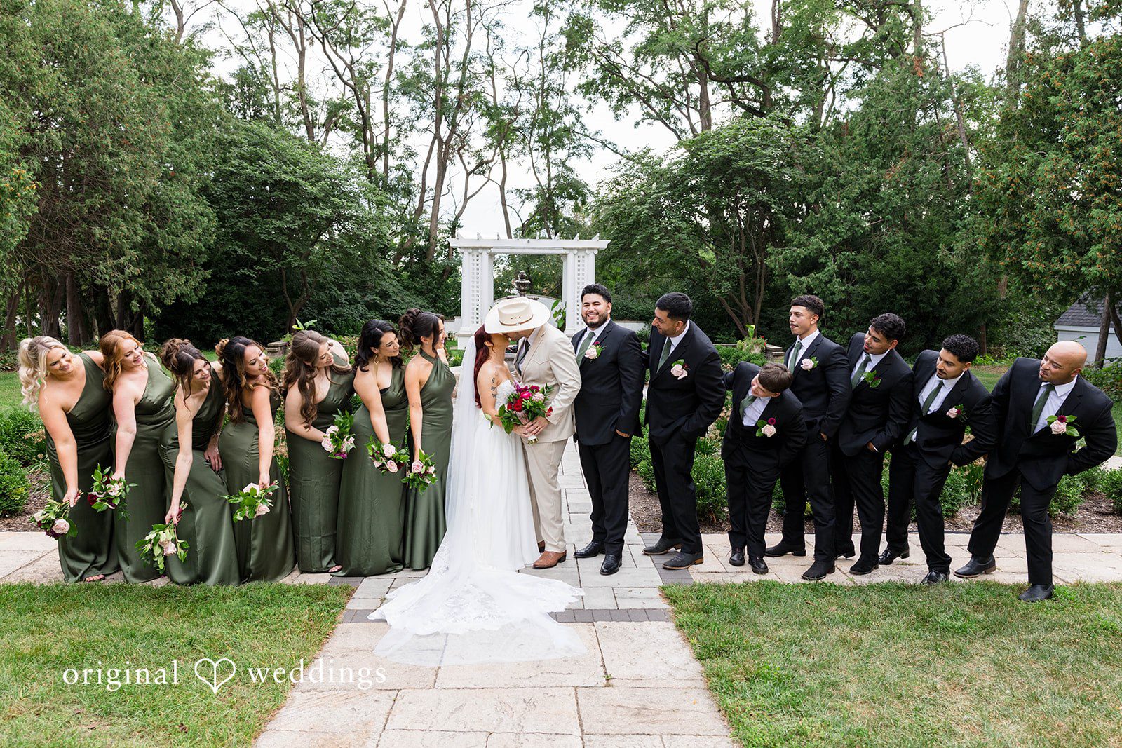 Andrea + Roberto Wedding party posing outdoors