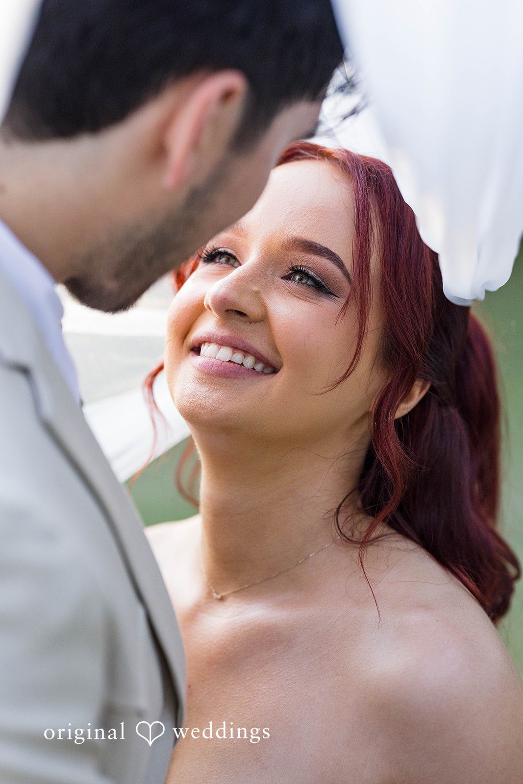 Andrea + Roberto Bride smiling up at the groom