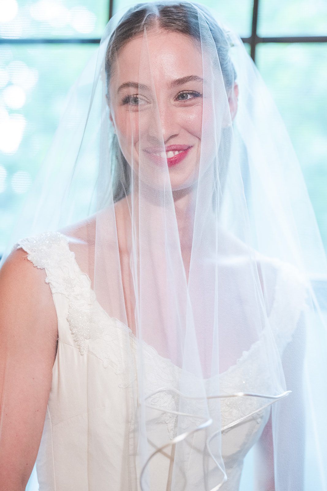 Bride wearing her veil