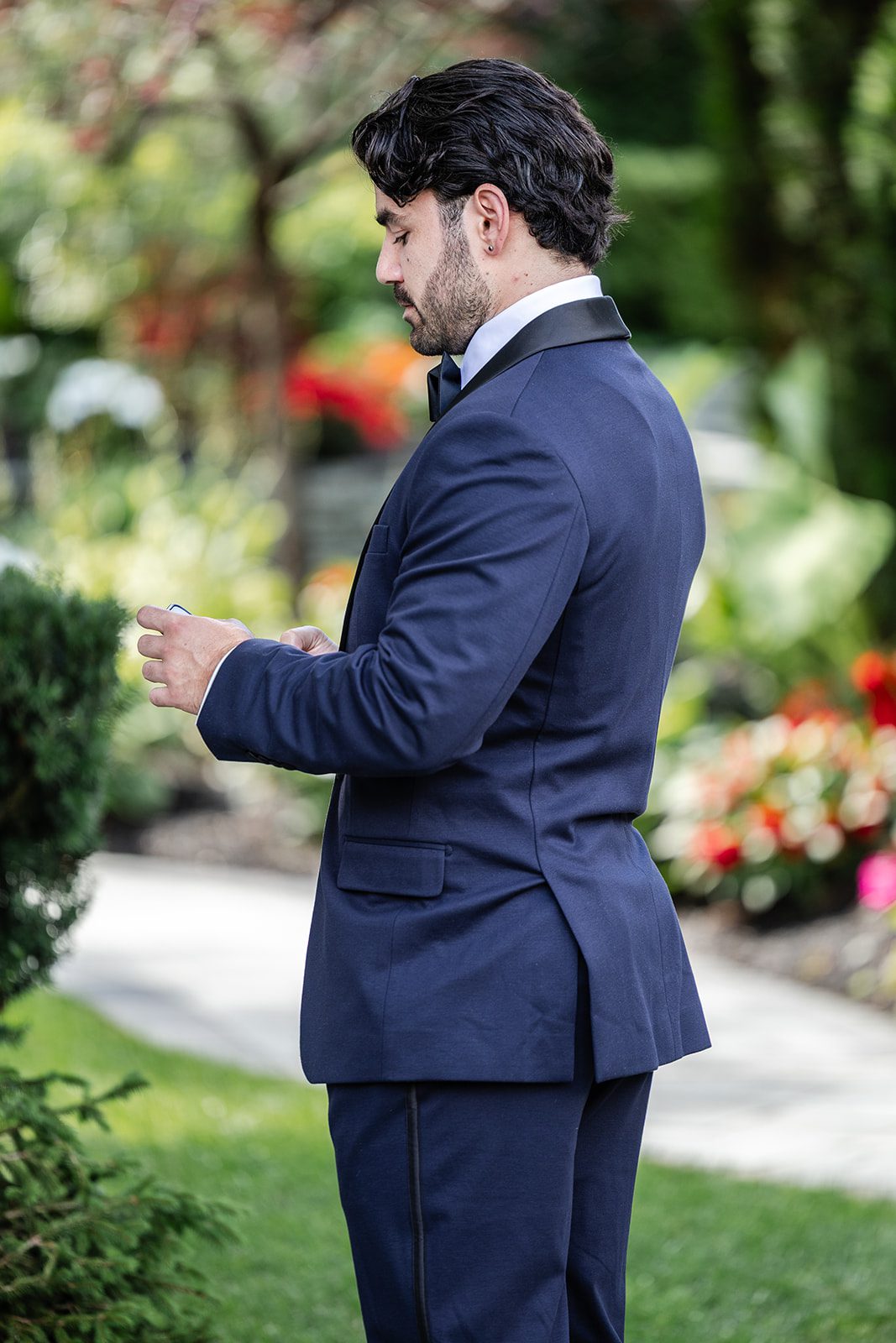 Groom in his navy tuxedo