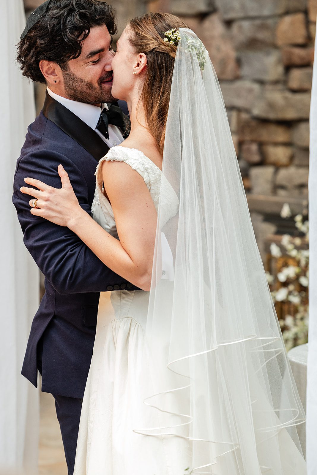 Couple smiling under the arch