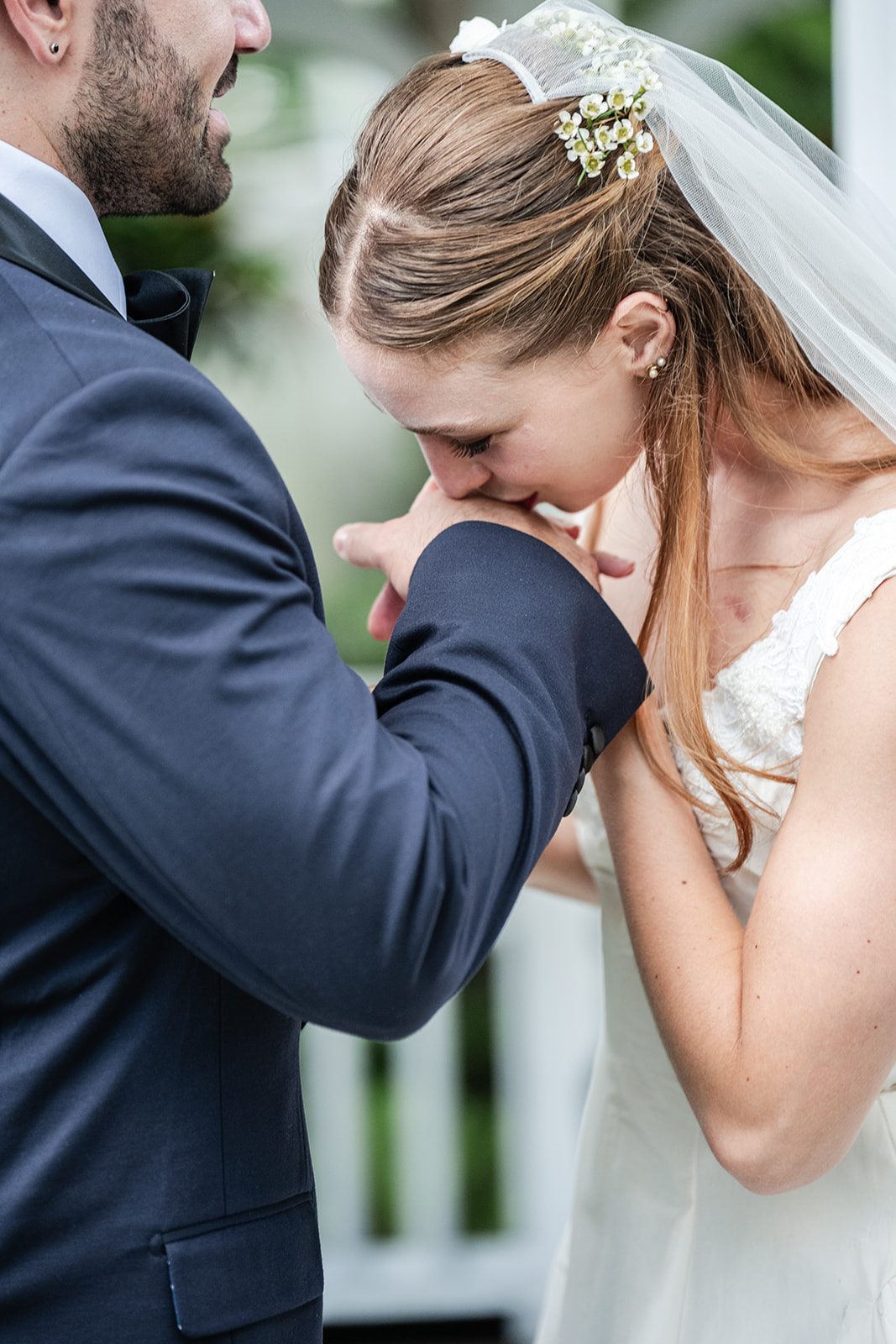 Bride and groom smiling at each other