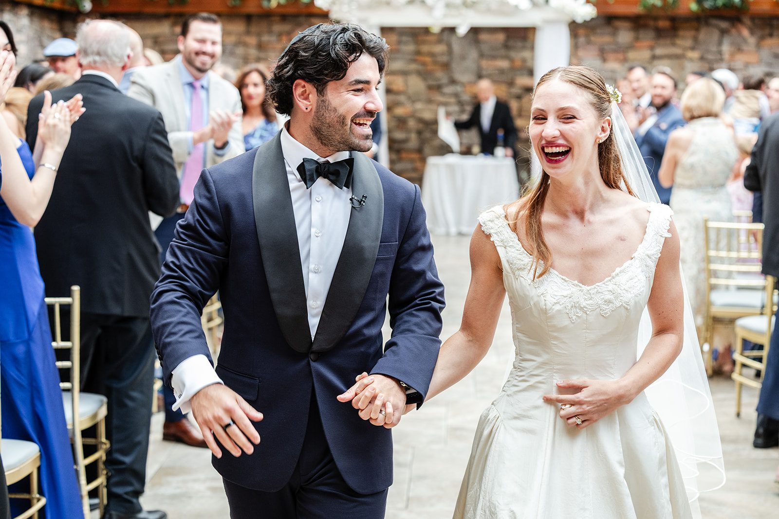 Newlyweds making their reception entrance at The Fox Hollow