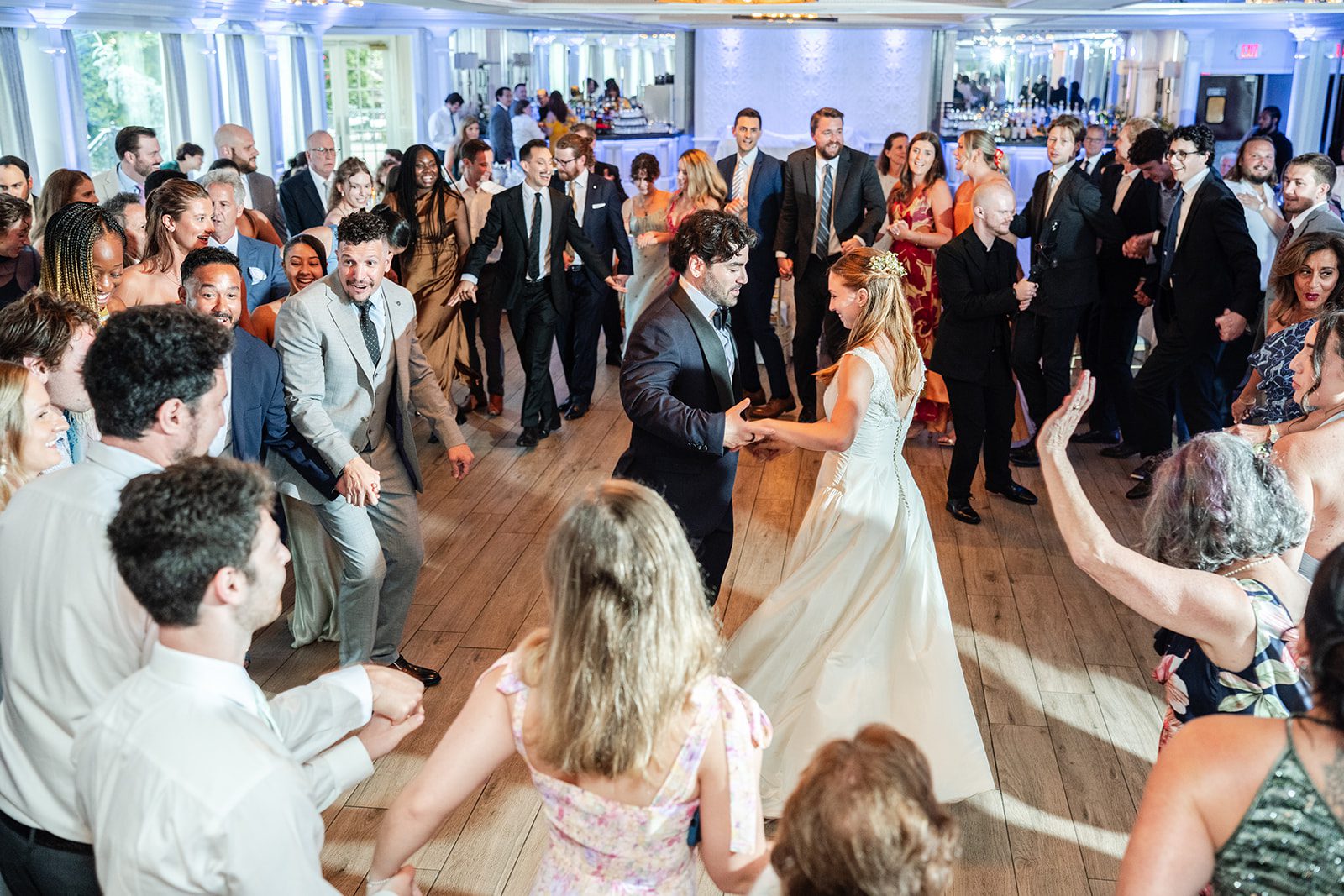 Guests dancing around the couple