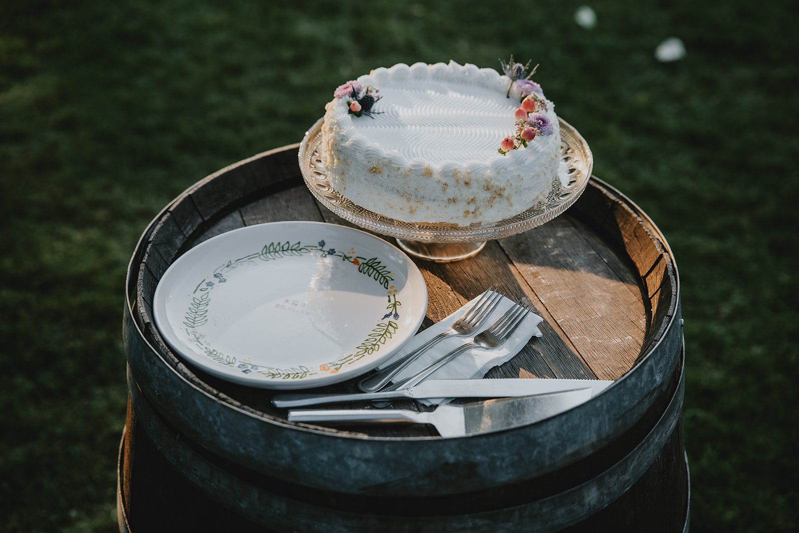 Wedding dessert display on a wooden barrel