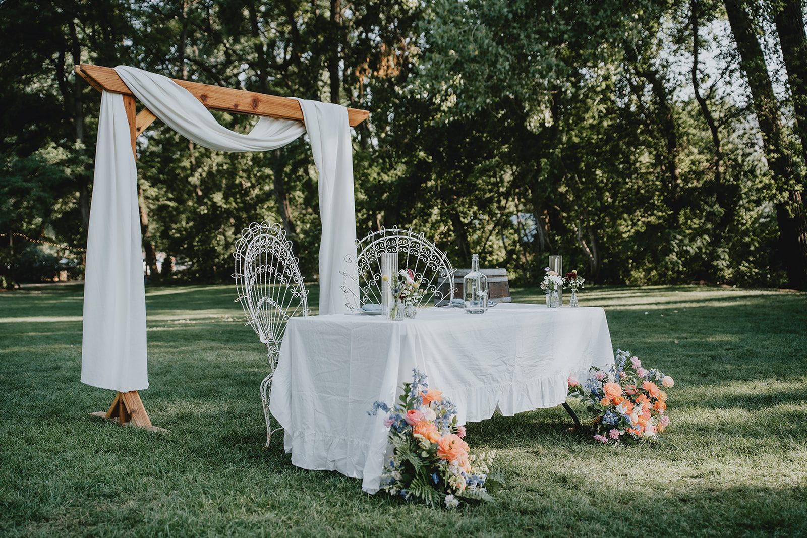 Sweetheart table with linens and blooms