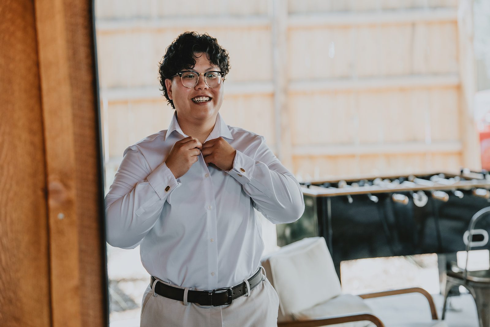Partner in a white shirt getting ready