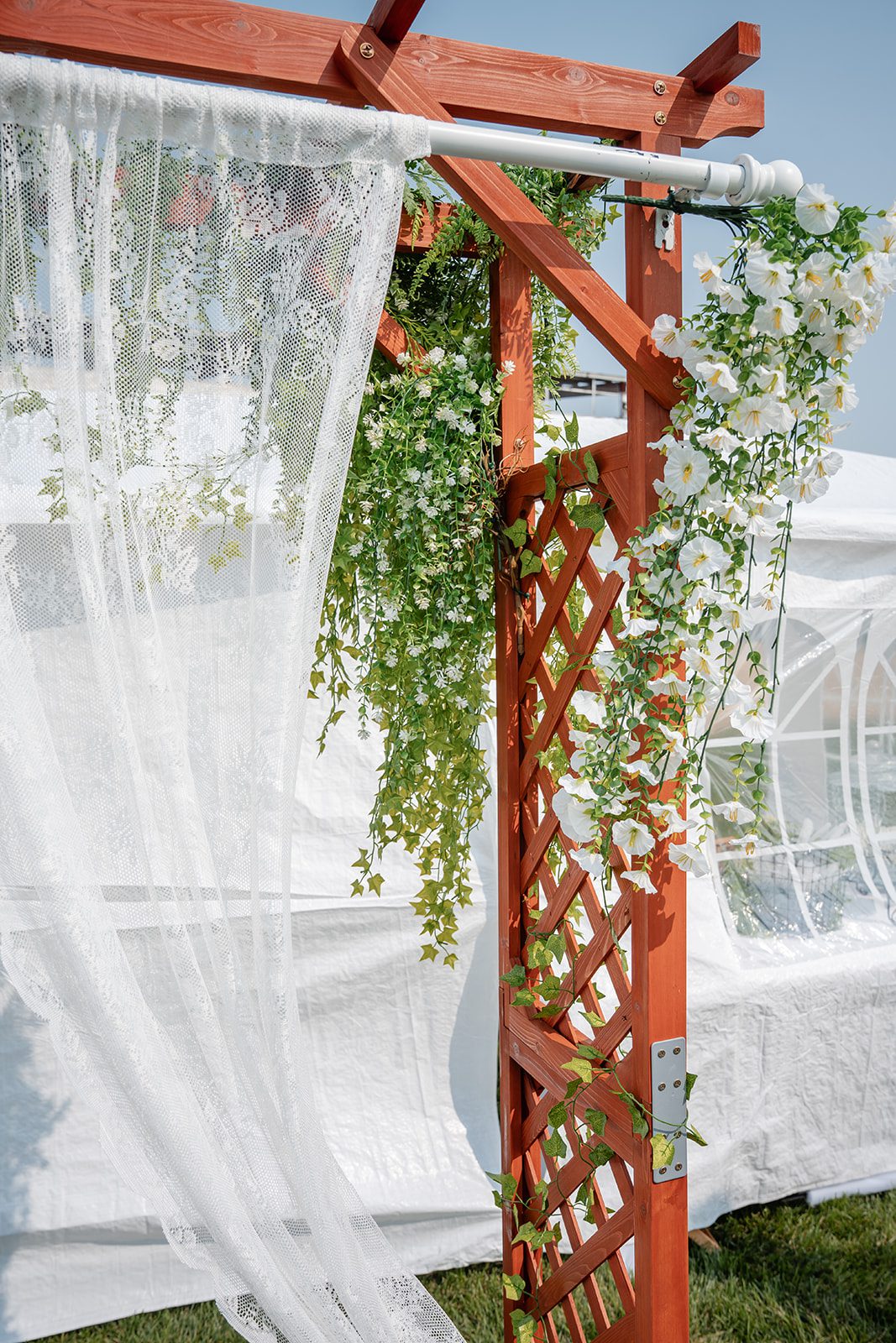the-midway-timeless-minneapolis-sarah-drew-p004-36 Ceremony arch draped with greenery and fabric