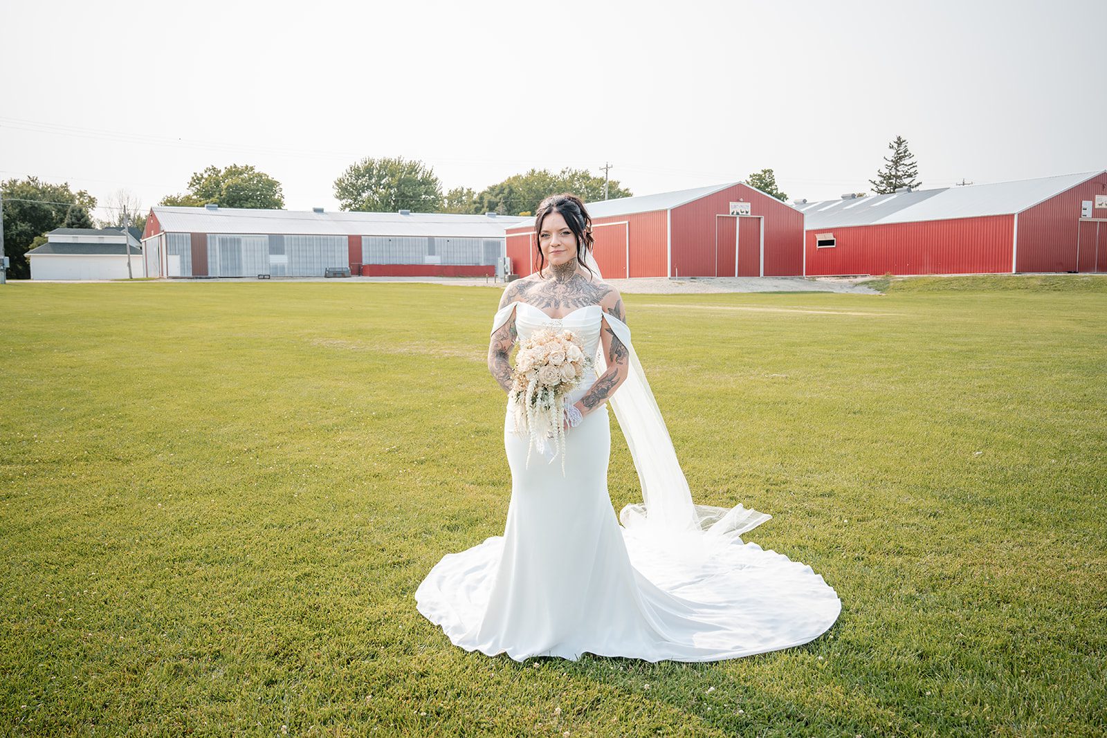 the-midway-timeless-minneapolis-sarah-drew-p012-38 Bride standing in the open field at The Midway