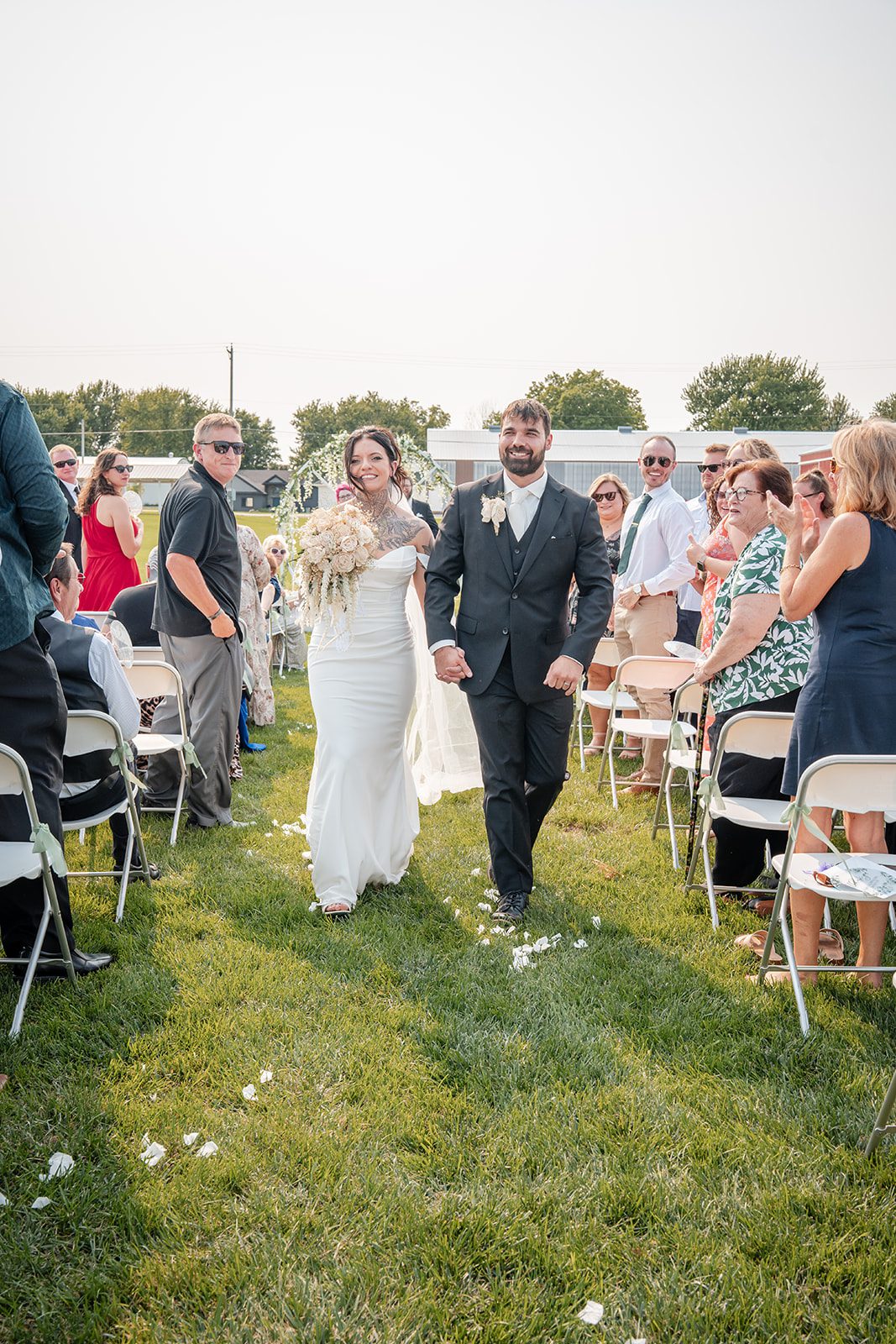the-midway-timeless-minneapolis-sarah-drew-p023-04 Newlyweds walking back up the aisle