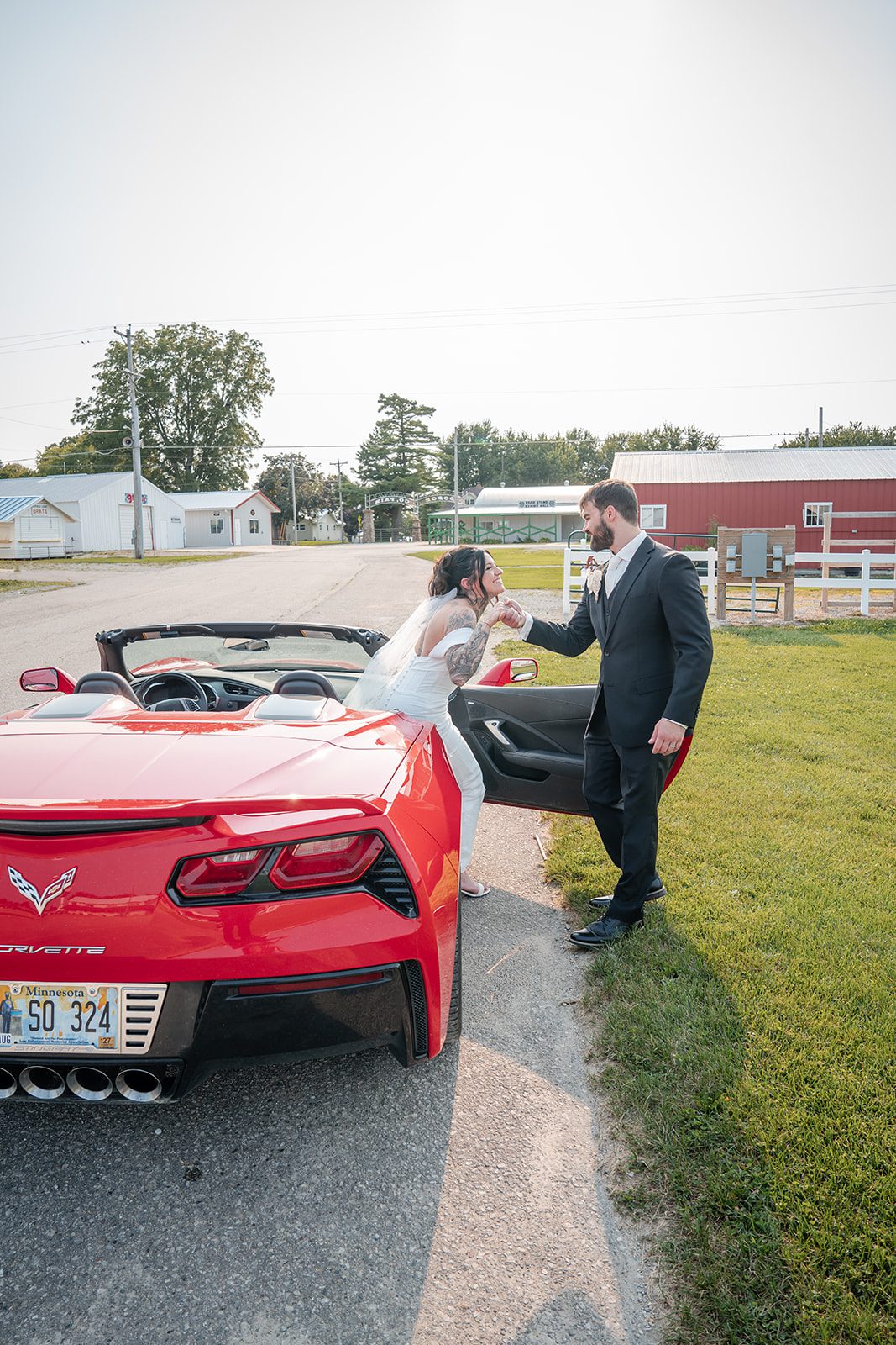 the-midway-timeless-minneapolis-sarah-drew-p024-05 Groom with a classic red sports car at The Midway