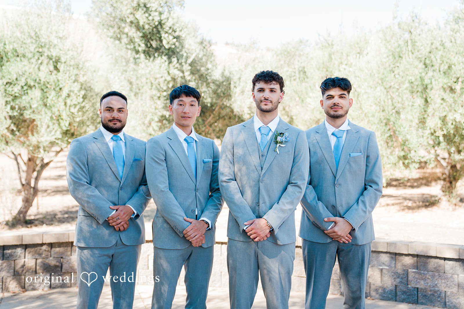Savannah + Lucas Groom with his groomsmen in matching suits
