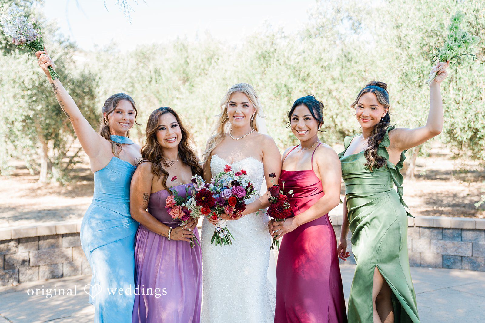 Savannah + Lucas Bride with her bridesmaids in jewel tone dresses