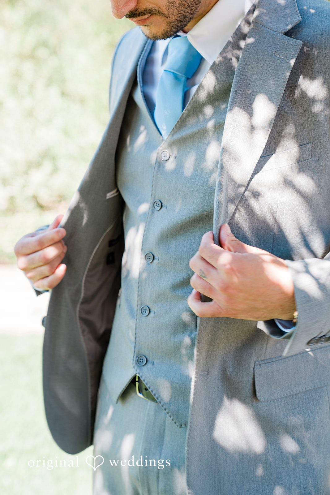 Savannah + Lucas Detail of the groom's gray suit
