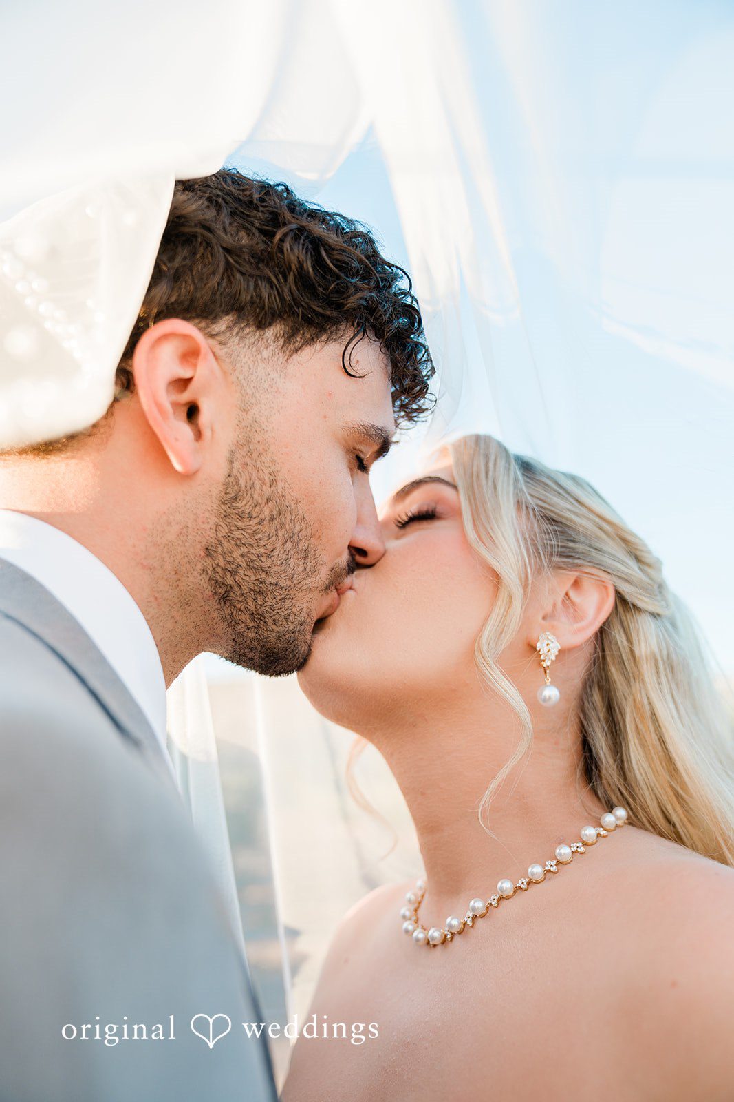 Savannah + Lucas Close up kiss in golden light