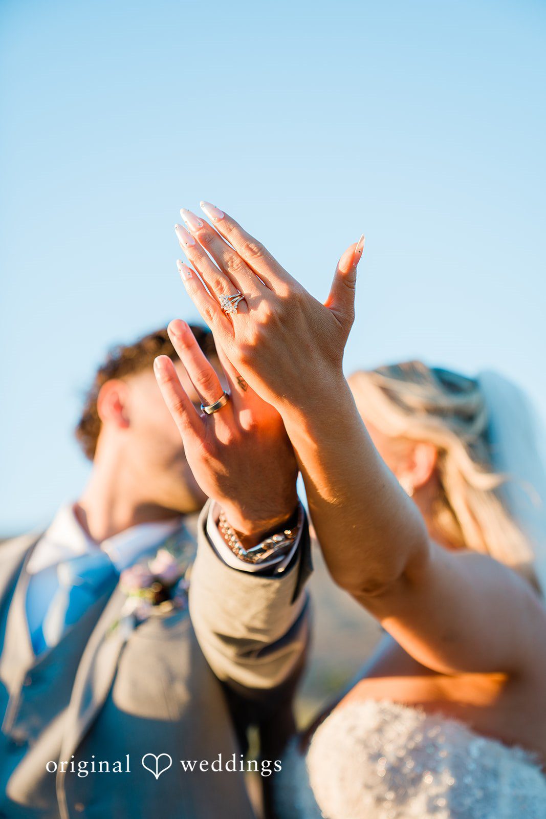 Savannah + Lucas Couple's hands raised together in celebration