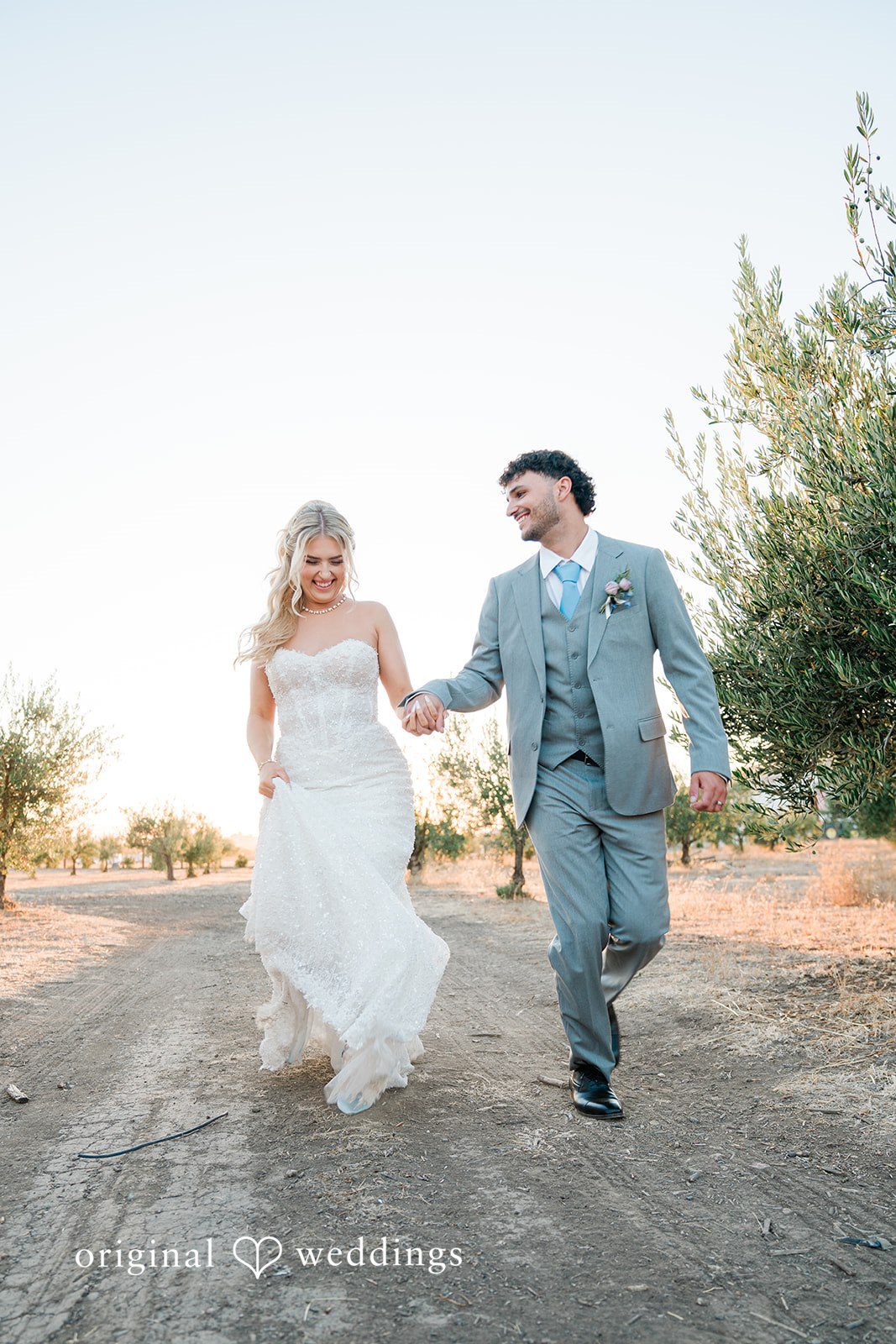 Savannah + Lucas Bride and groom walking down the path, captured by San Francisco wedding photographers from Original Weddings