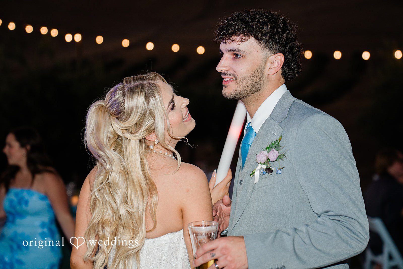 Savannah + Lucas Couple smiling under the string lights at The Purple Orchid