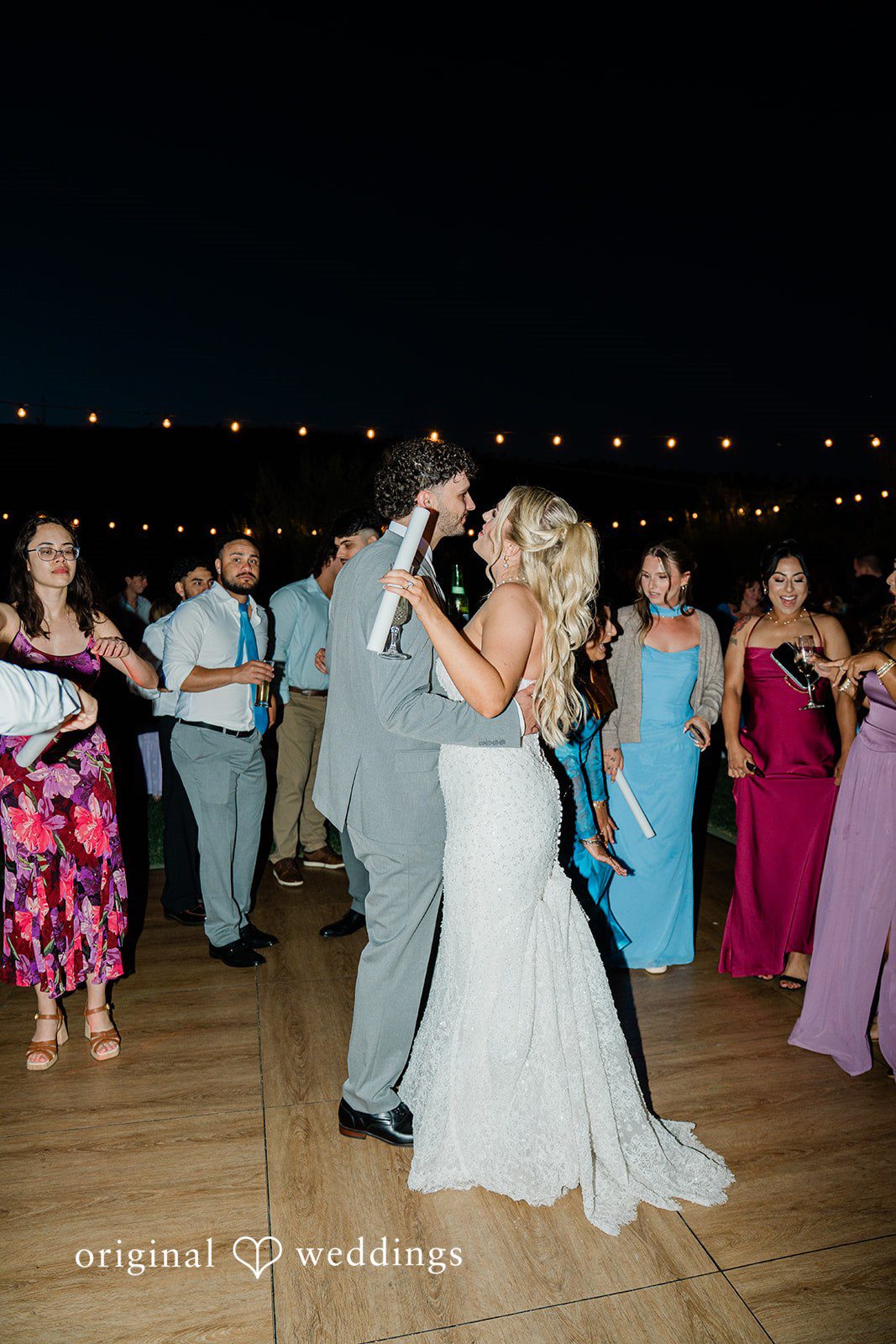 Savannah + Lucas Couple dancing with guests at night