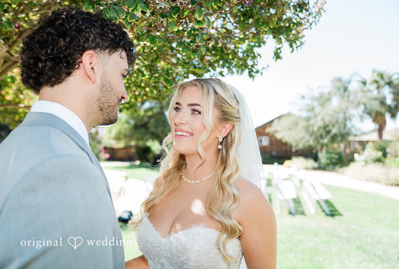 Savannah and Lucas smiling at each other, captured by San Francisco wedding photographers from Original Weddings at The Purple Orchid