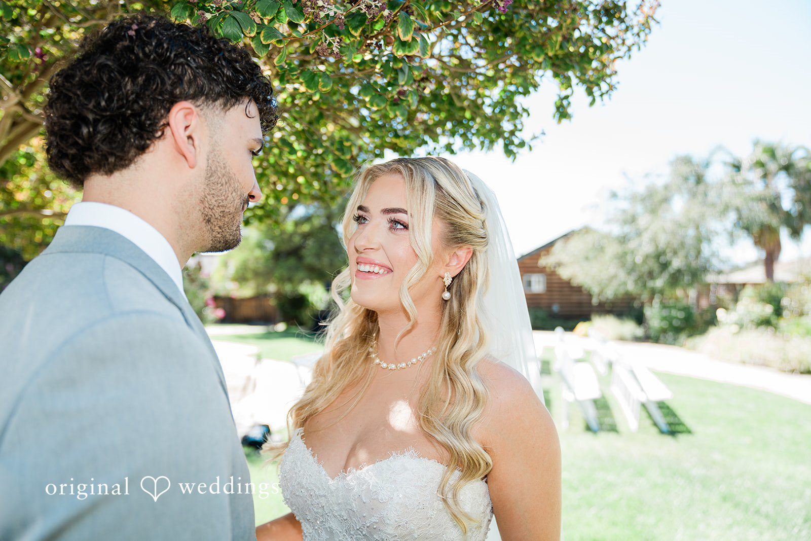 Savannah + Lucas Savannah and Lucas smiling at each other, captured by San Francisco wedding photographers from Original Weddings at The Purple Orchid