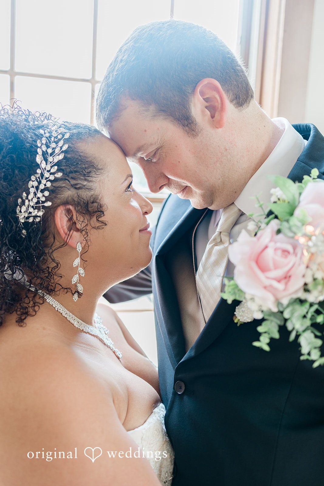 Daniel + Dalte A close-up view of a bride and groom looking into each other's eyes.