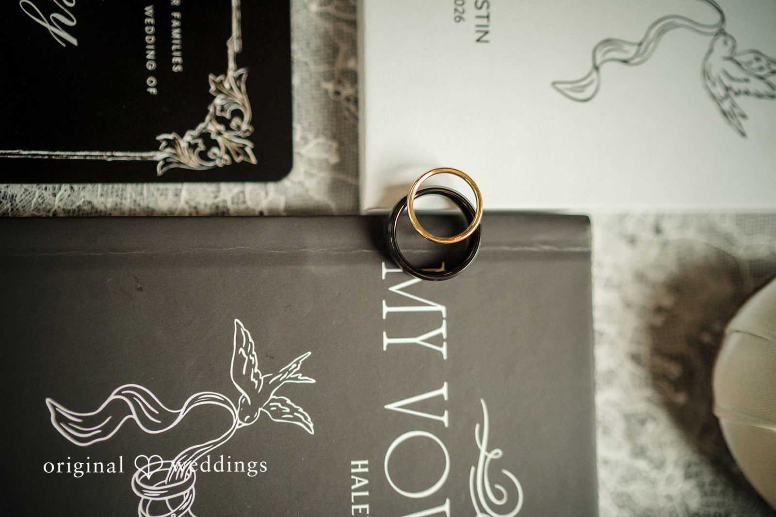 Haley + Austin A close-up shot of personal items, including a guest book or card featuring text script.