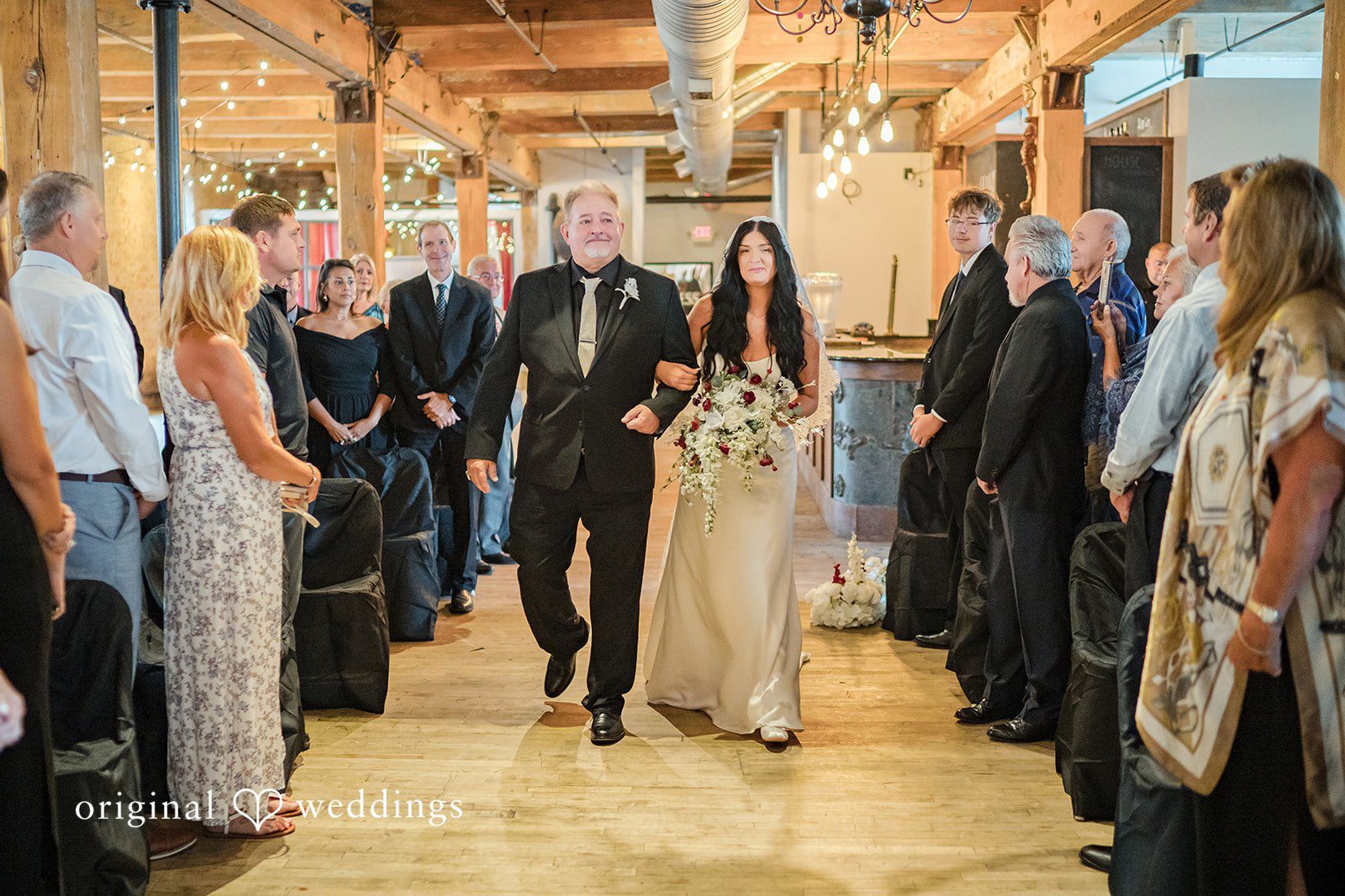 August 01, 2026 – Haley & Austin – (ID-4892) Wedding guests standing in rows along the aisle during a ceremony.