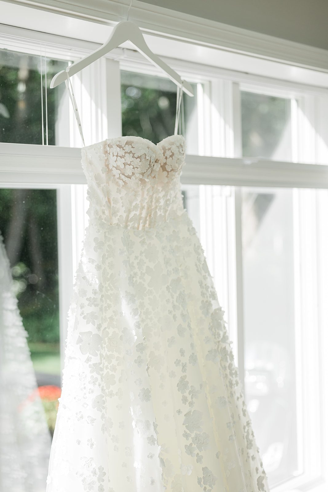 the-wharf-airy-boston-lia-cam-003-43 Wedding dress hanging by the window