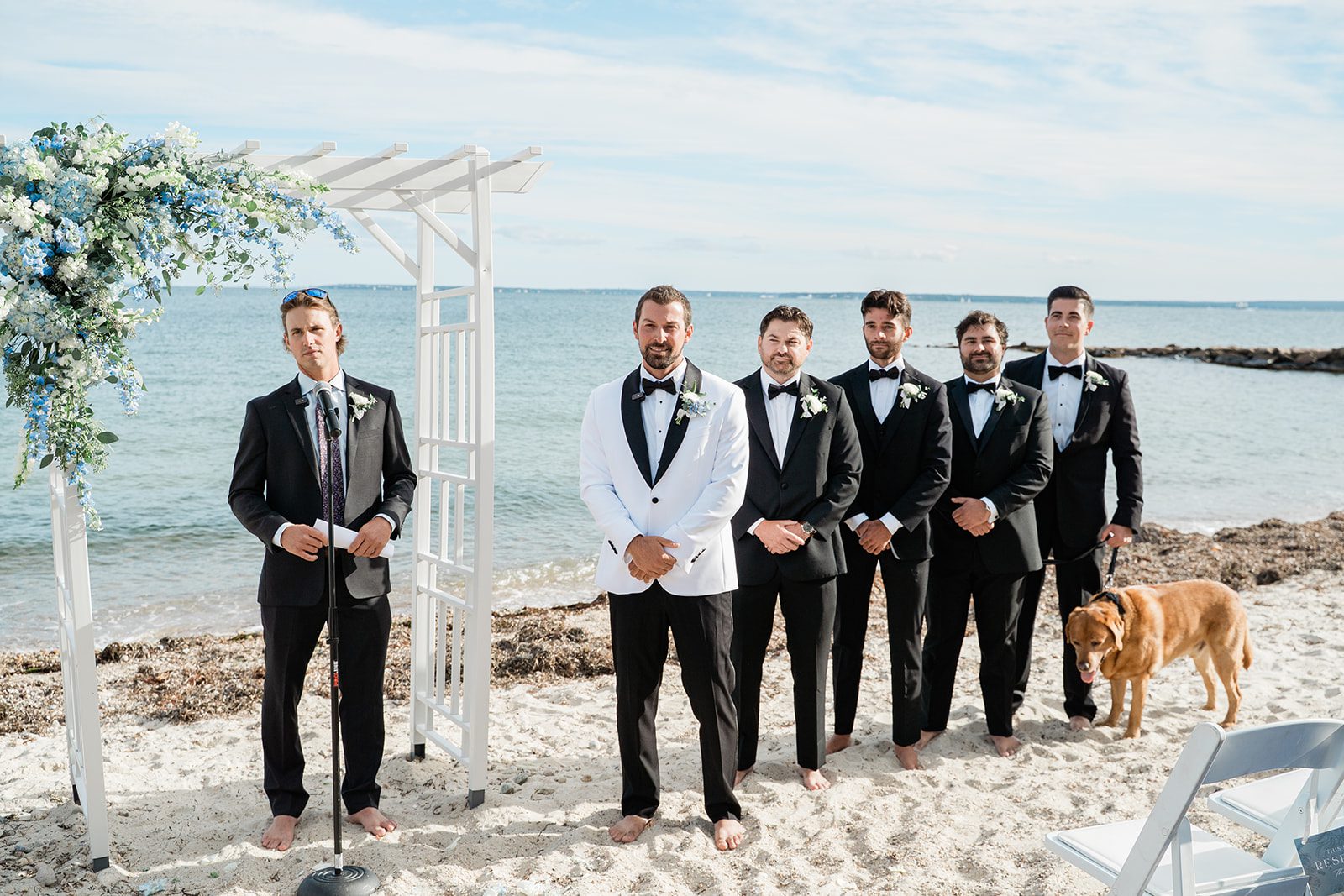 the-wharf-airy-boston-lia-cam-012-53 Groom and groomsmen with the dog flower girl on the beach