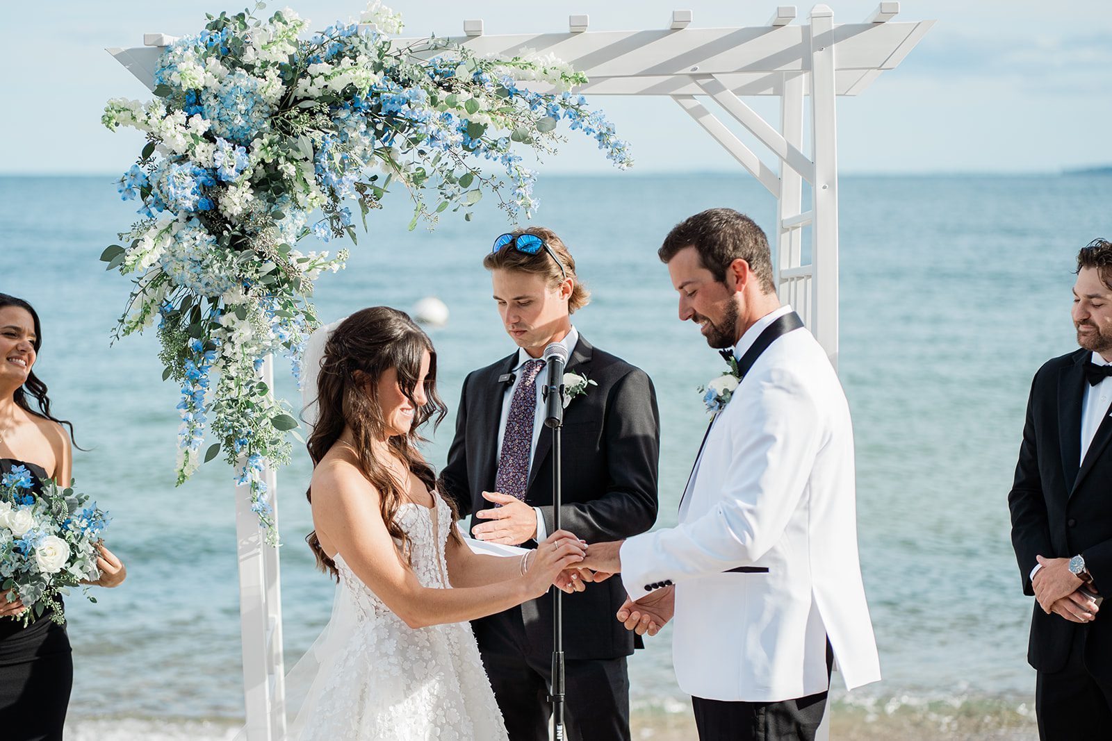the-wharf-airy-boston-lia-cam-016-05 Bride and groom exchanging vows by the water