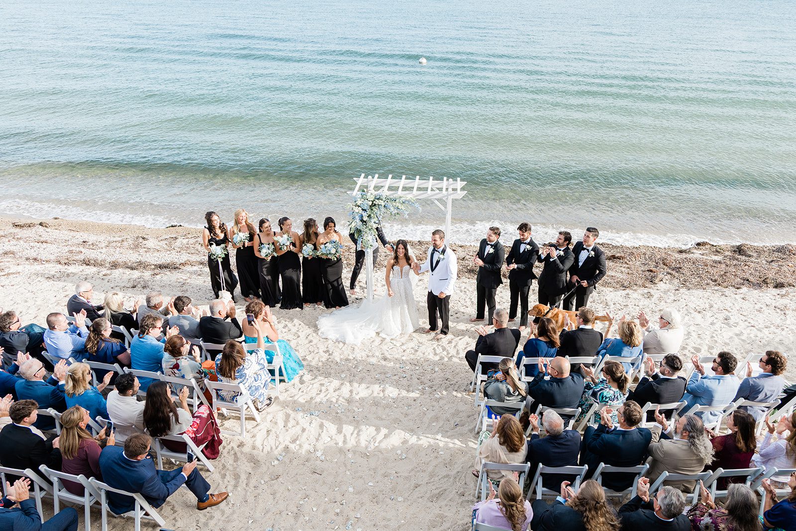 the-wharf-airy-boston-lia-cam-018-04 Guests watching the ceremony on the sand