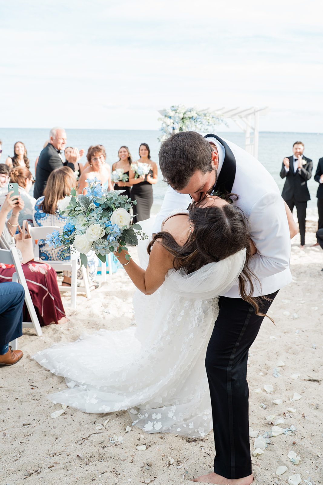 the-wharf-airy-boston-lia-cam-020-49 Newlyweds hugging after the ceremony