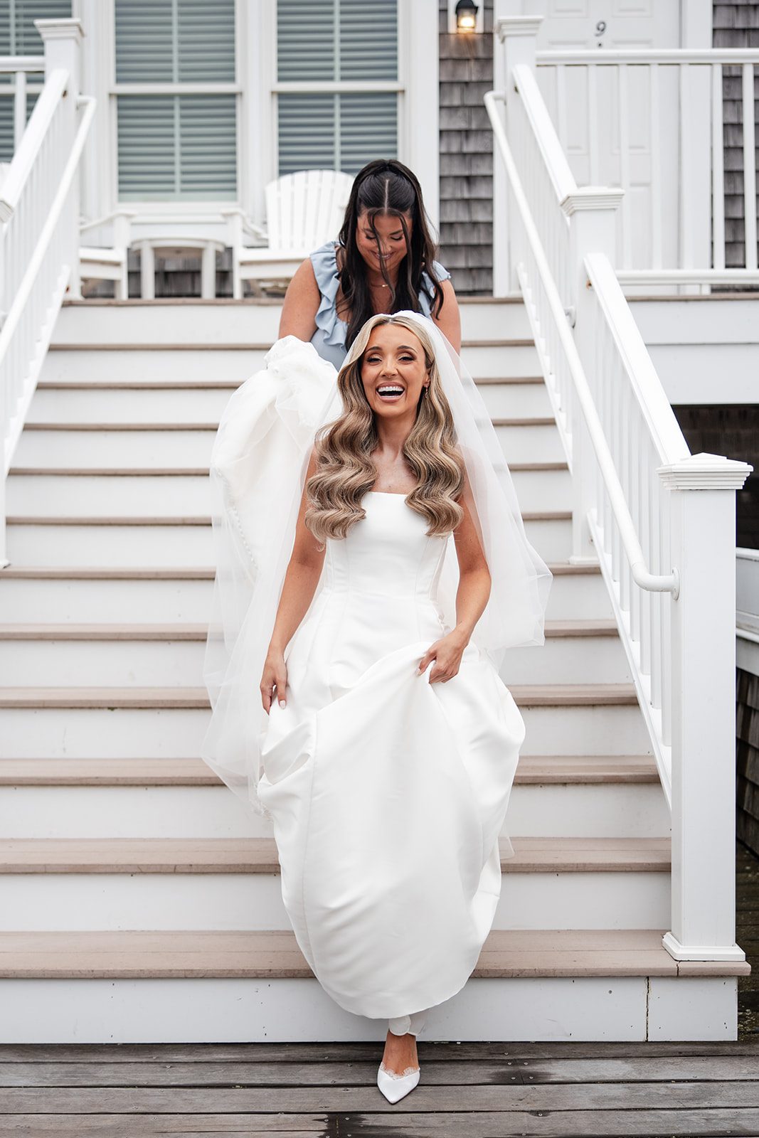 Bride walking down the outdoor staircase
