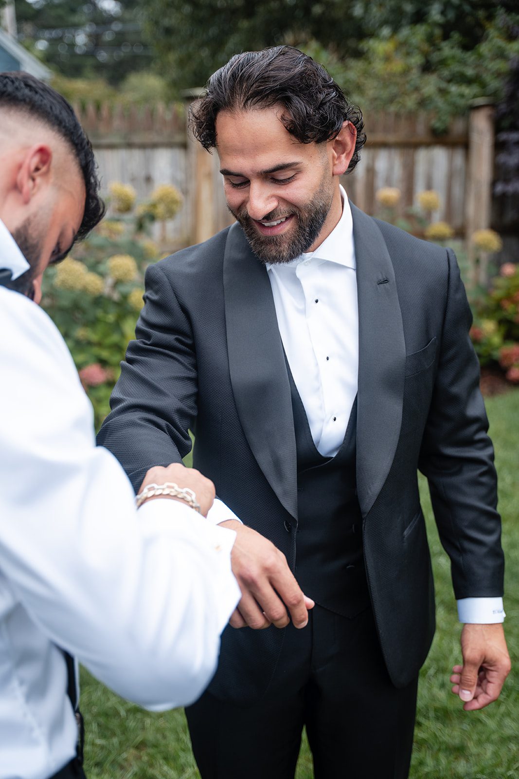 Groom fixing his cufflinks