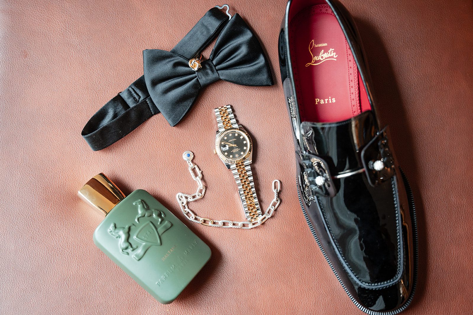 Groom's bow tie, shoes and cologne