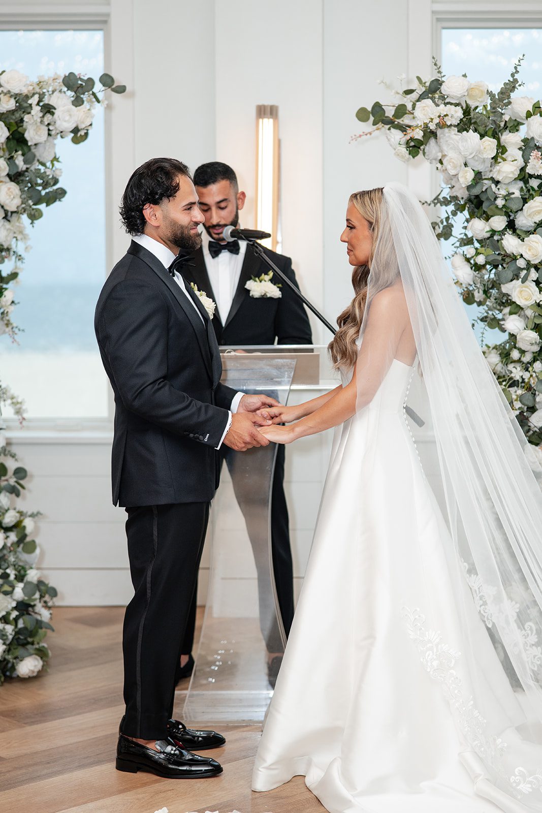 Couple holding hands during the indoor ceremony at The Wychmere