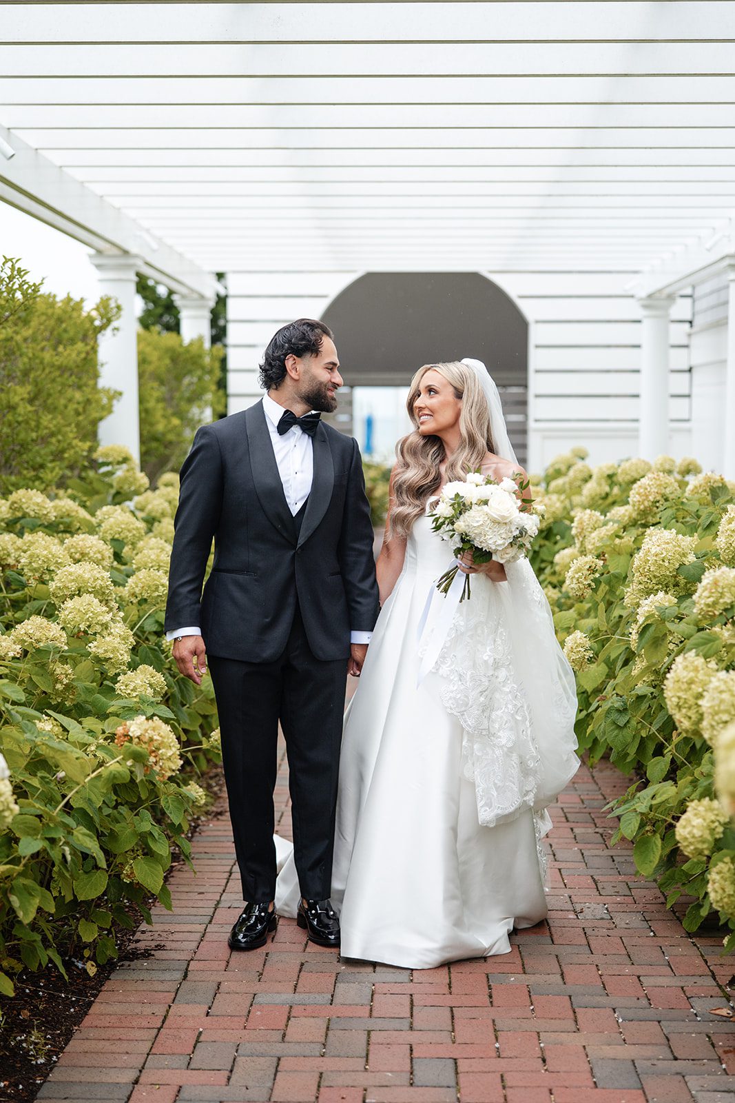 Couple smiling among the blooms at The Wychmere