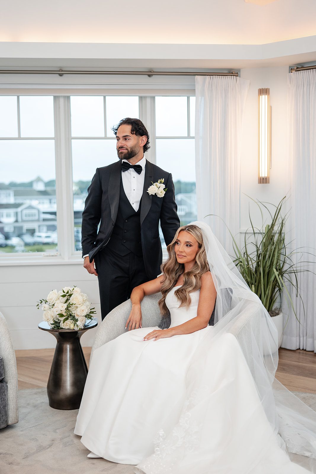 Bride seated with the groom in the bright lounge