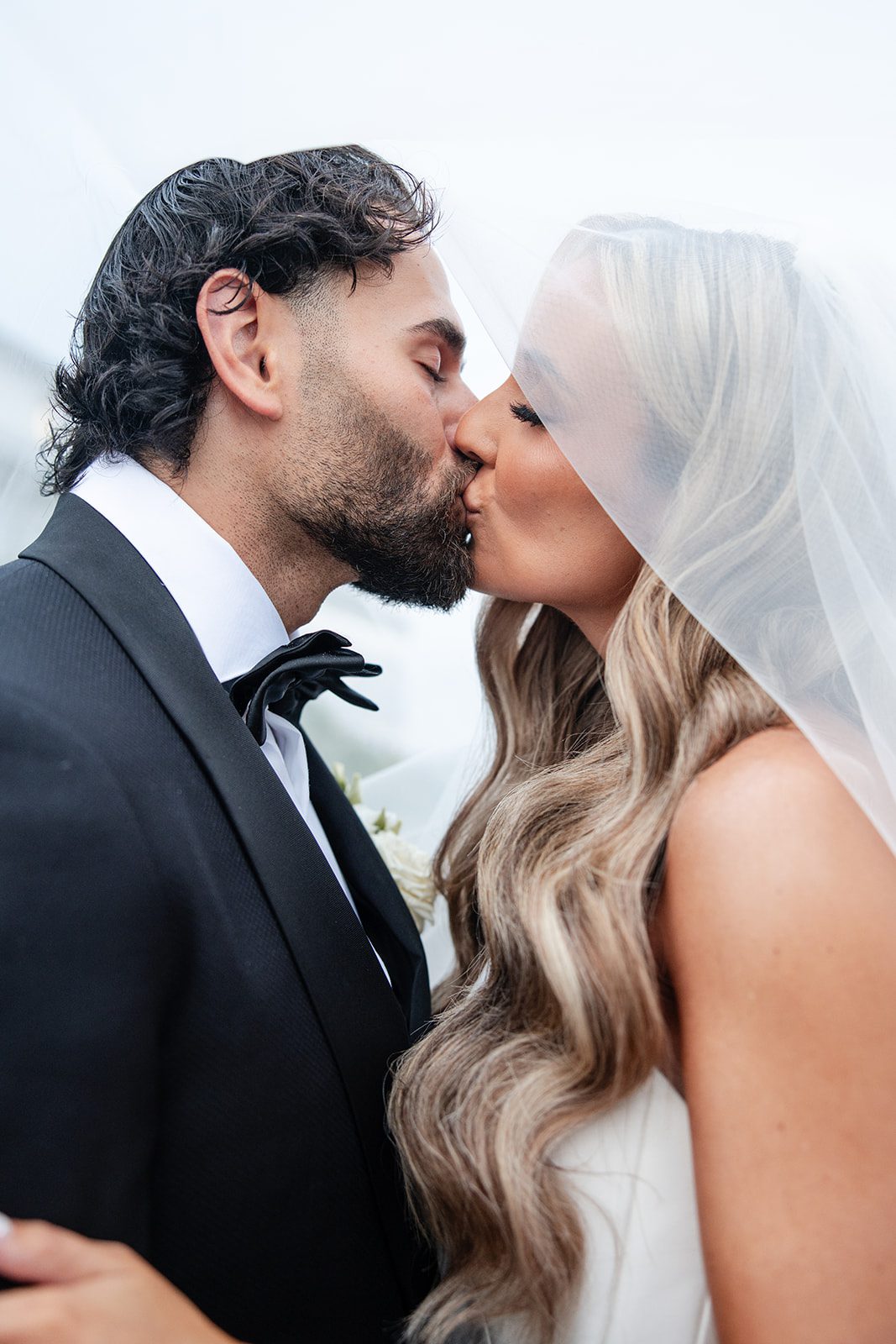 Romantic kiss outside the clubhouse