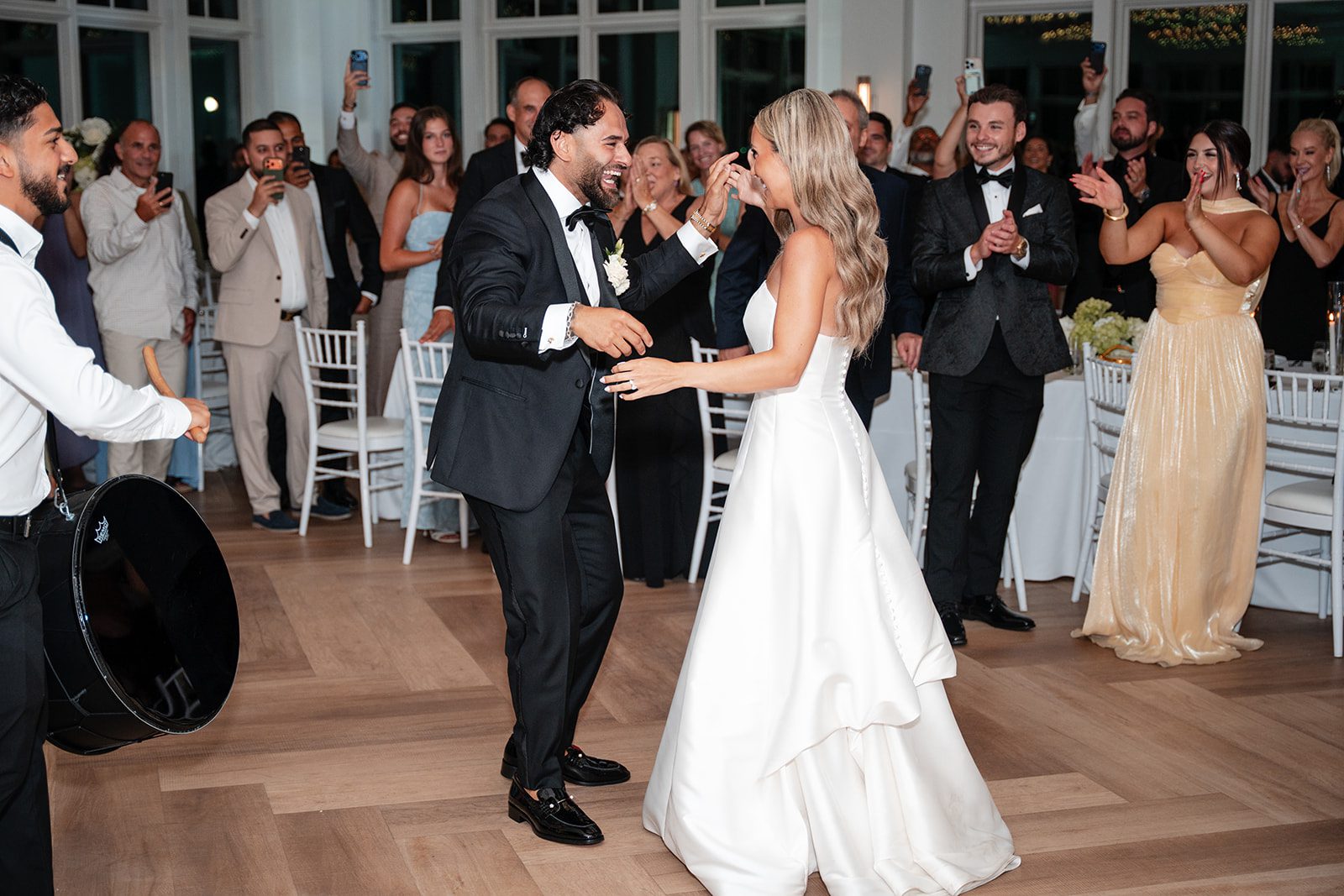 Bride and groom making their grand entrance, captured by Boston wedding photographers from Original Weddings at The Wychmere