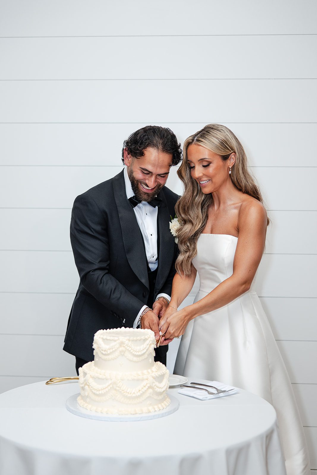 Bride and groom cutting the cake