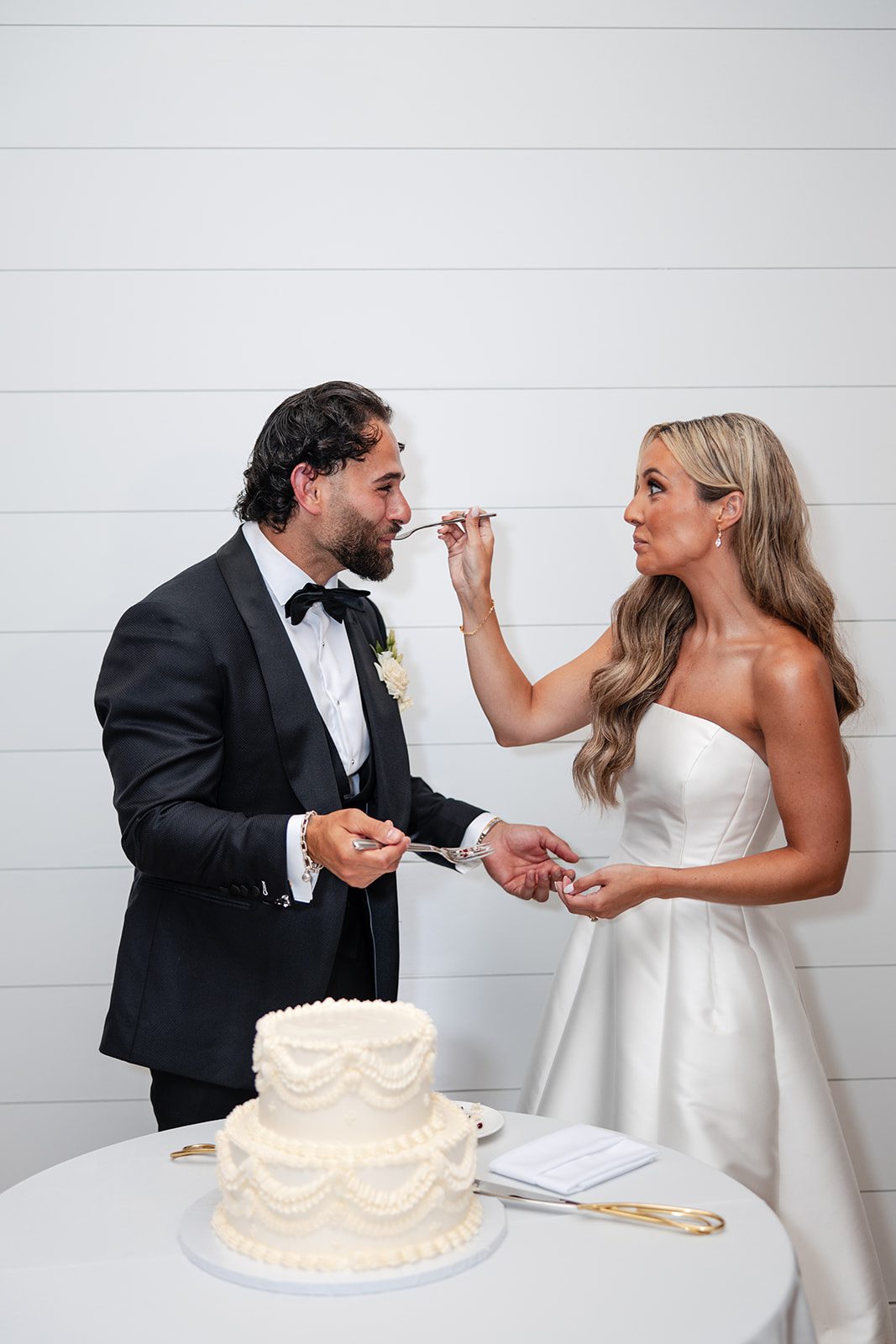Couple feeding each other cake